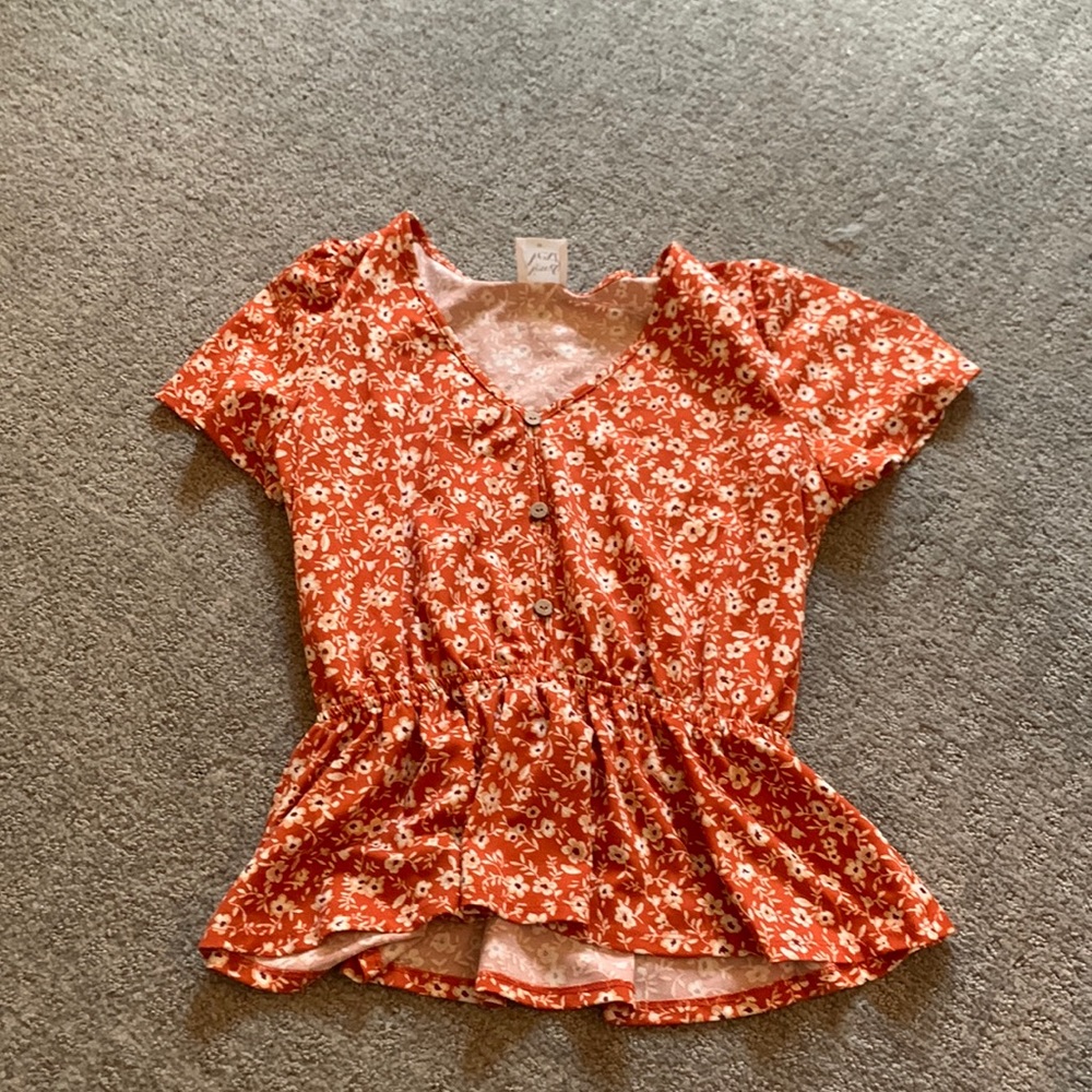 orange floral blouse